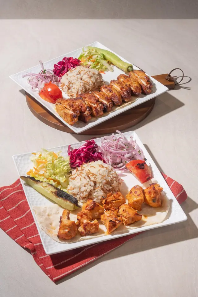 Charcoal-grilled chicken wings and chicken shish skewers