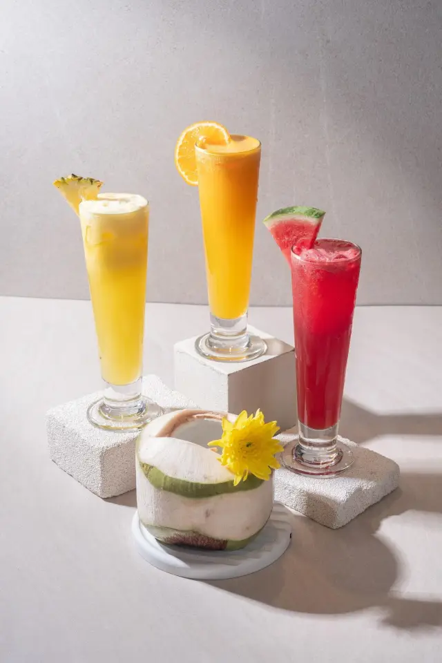 Freshly pressed watermelon, orange and pineapple juices