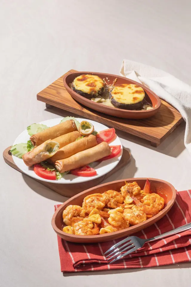 Cheese-baked mushrooms, crispy cheese rolls and shrimp casserole