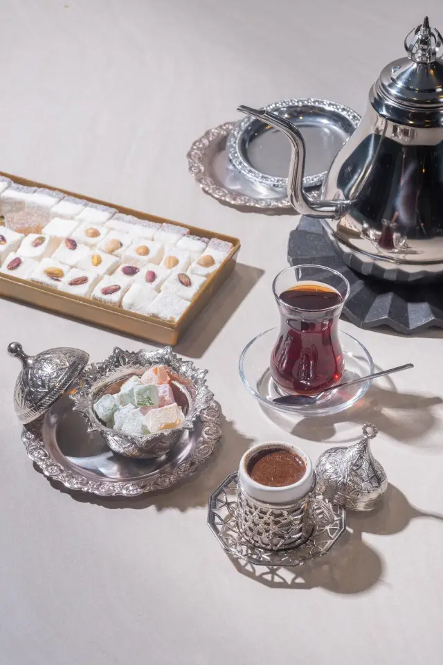 Turkish coffee brewed in a cezve, served with Turkish delight
